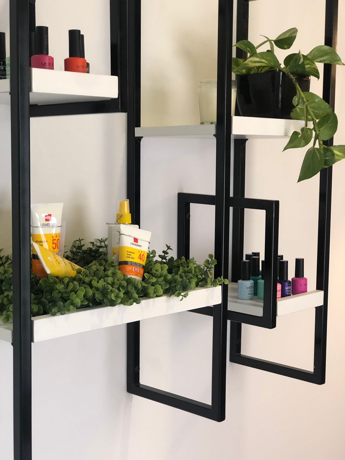 Modern facial aesthetics and laser skin care treatment station in a boutique clinic, sleek modern equipment, clean hygienic luxurious environment, warm ambient cove lighting